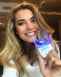Wisconsin graduate using Crystal Clear teeth whitening kit